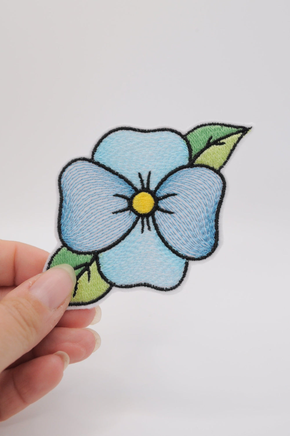 Flicken in Form eine Blume, türkis