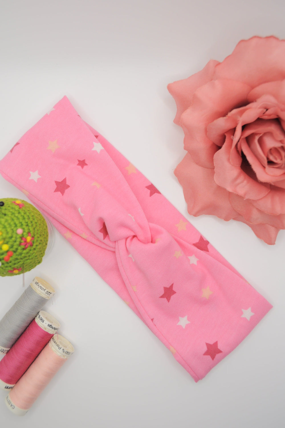 BaumwolleJersey Haarband mit twist, rosa mit Sterne